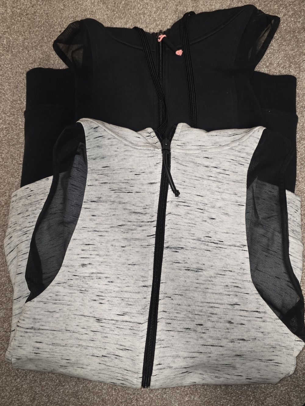 2 Sleeveless TLF gym tops